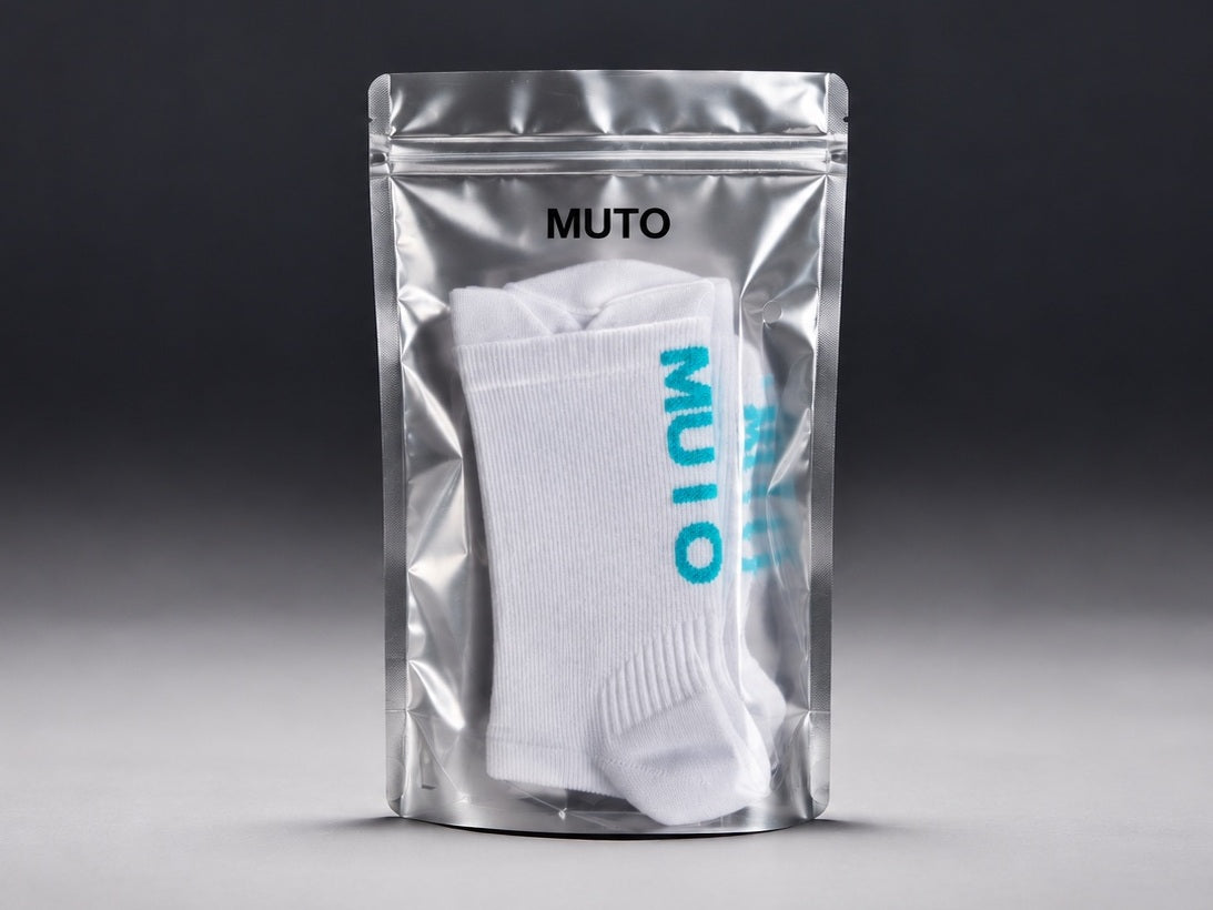 A pouch of MUTO Performance Socks, the white sock visible through the front
